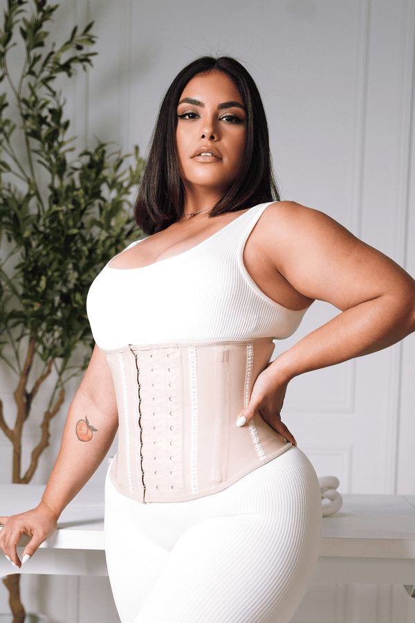 Nude latex waist trainer. tightest fitting waist cincher